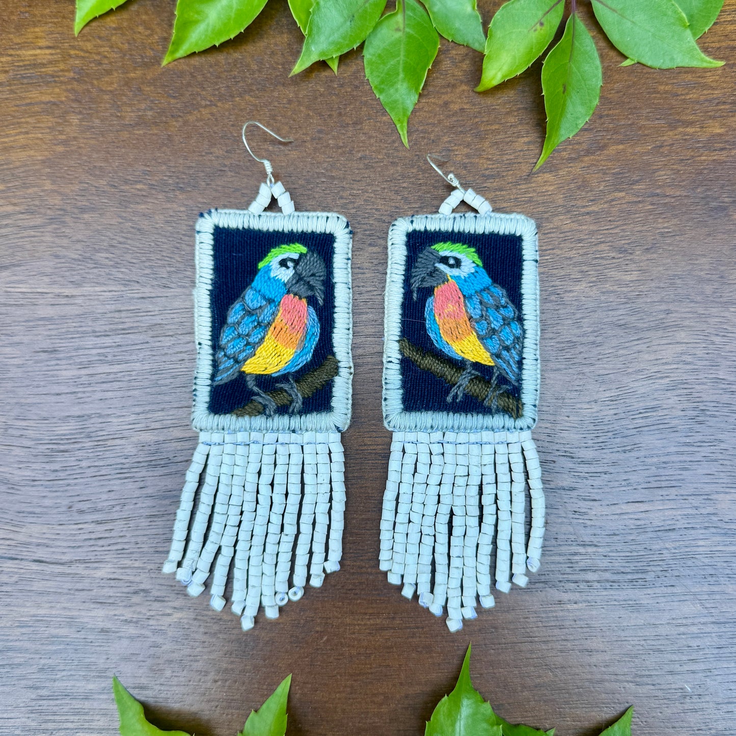 Handmade Guatemalan Embroidered Blue Bird Earrings with Clay Bead Fringes and Silver Hooks, white