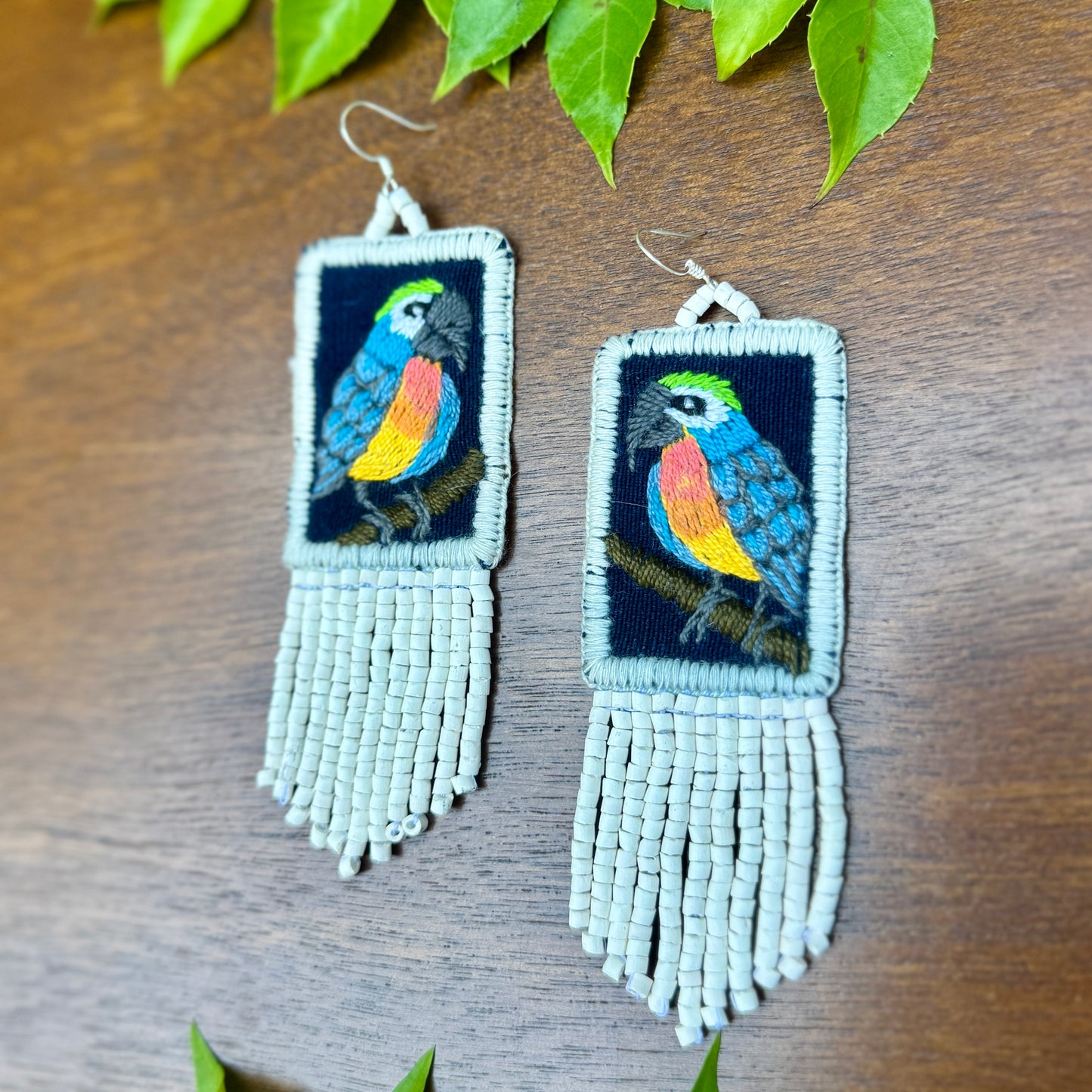 Handmade Guatemalan Embroidered Blue Bird Earrings with Clay Bead Fringes and Silver Hooks, white