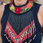 Bib necklace with colorful beaded design and floral embroidery.